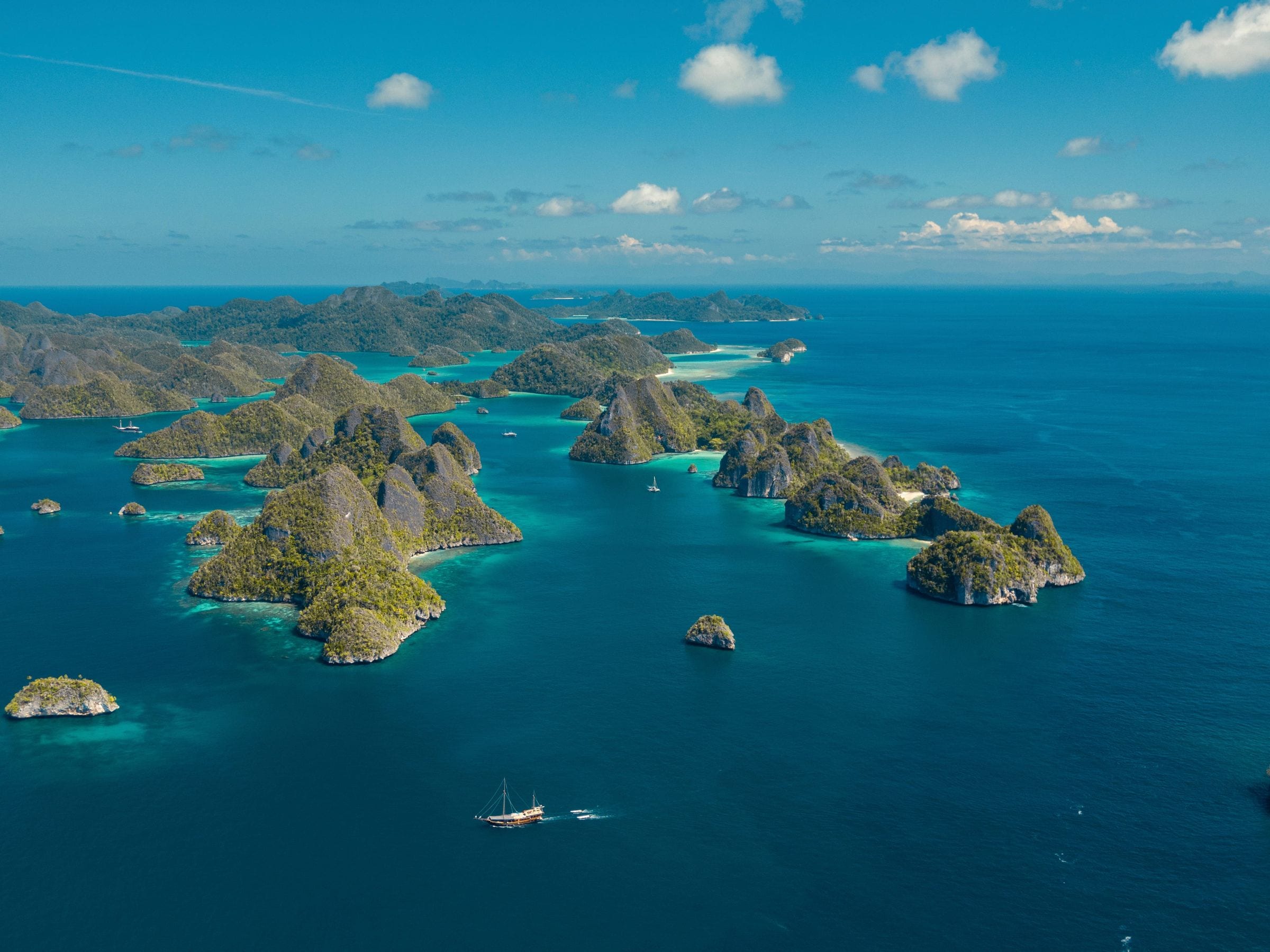 Clear shallow sea over a coral reef in Raja Ampat