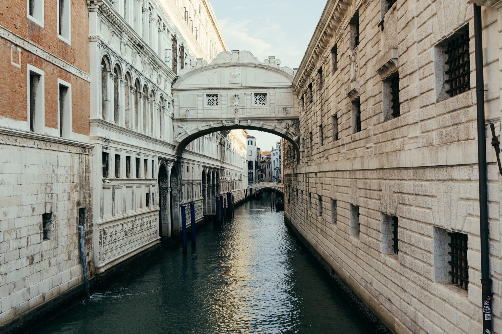 The Bridge of Sighs arching over a quiet Venetian canal